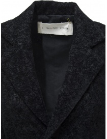 A Tentative Atelier blazer in black lace with satin ribbon